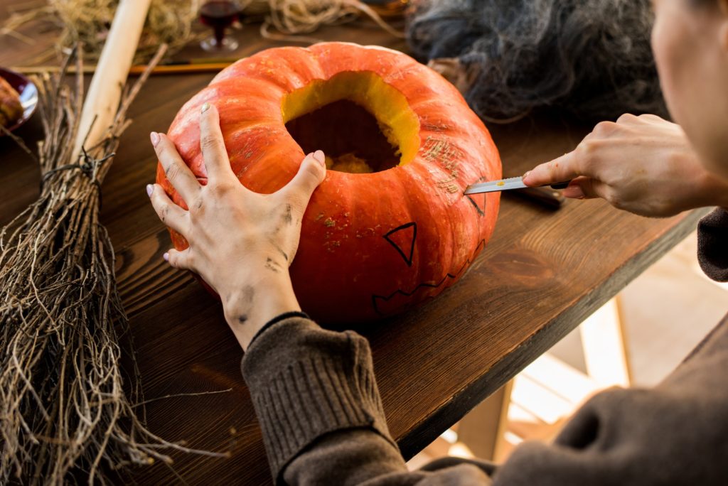 Carving pumpkin in workshop